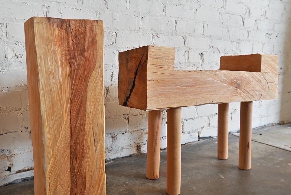 wooden end table with sculpted bench