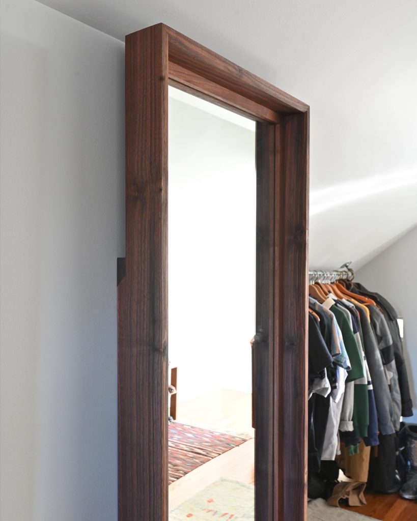 wooden designer full length mirror in swanky apartment