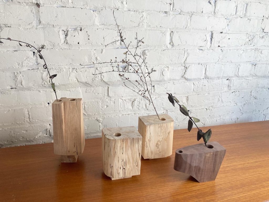 small wooden modern vases with plant stems
