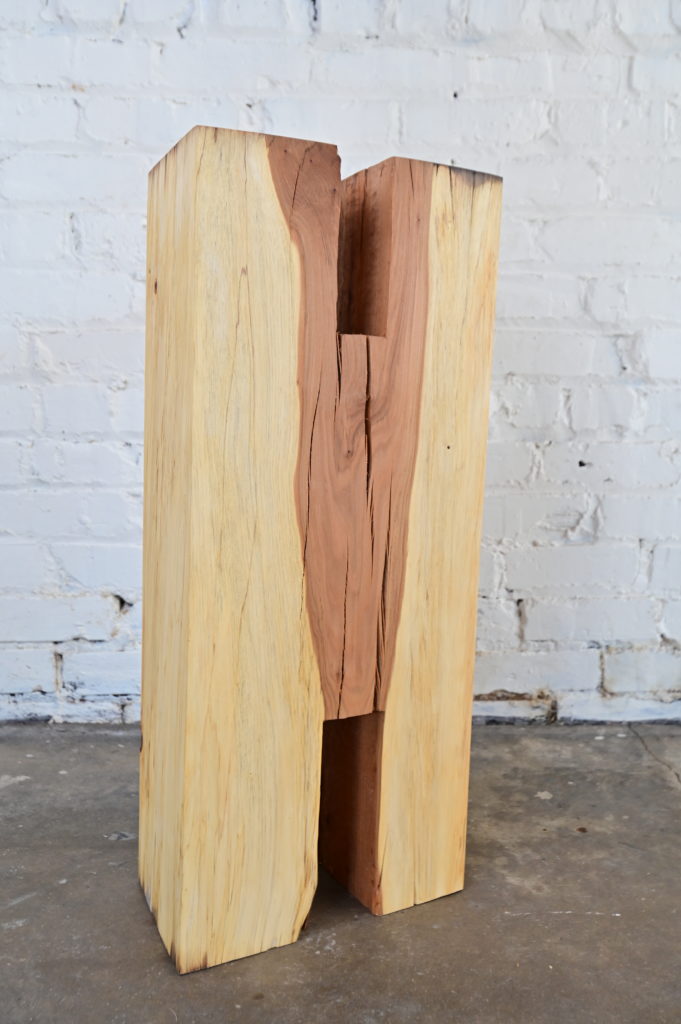 wooden sculpture in the form of an H