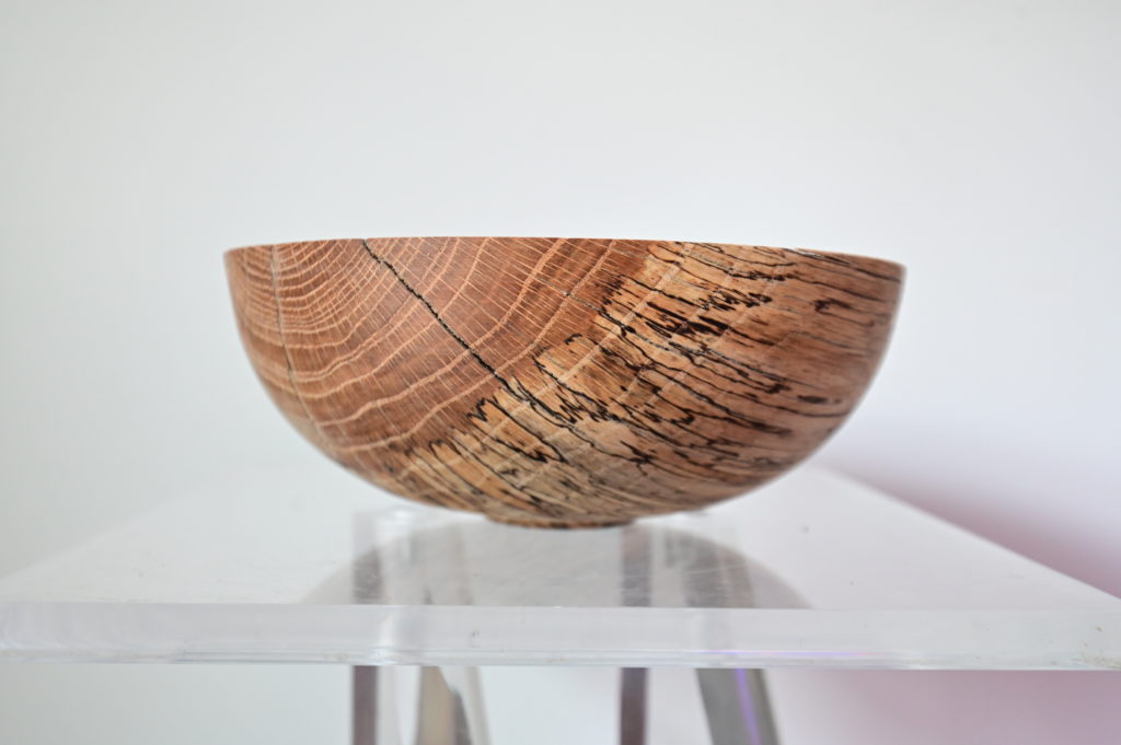 an artist made wooden bowl in a gallery