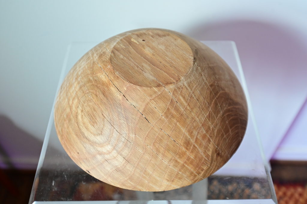 the bottom of a piece of wooden art