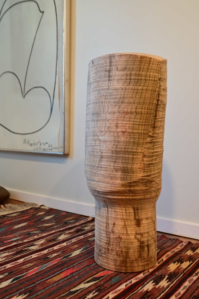 abstract wooden sculpture in stylish apartment